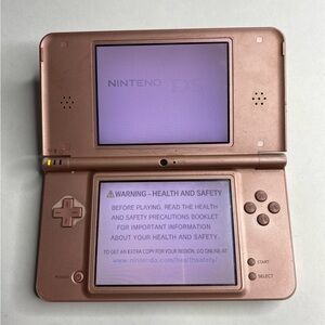 Nintendo DSi XL Pink with 2 random games